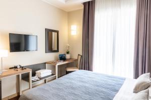 Телевизор и/или развлекательный центр в Grand Hotel Spiaggia