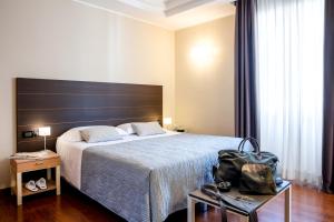 Кровать или кровати в номере Grand Hotel Spiaggia