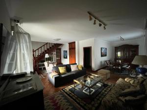 a living room with a couch and a table at Casa Santa Ana in Tourón
