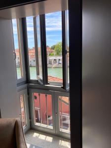 a view out of a window of a building at Hotel Dei Dragomanni in Venice