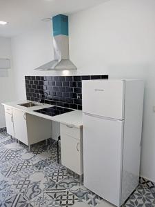 Kuchyň nebo kuchyňský kout v ubytování AYZ Silvela - Auto check-in property