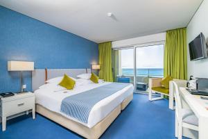 Cama ou camas em um quarto em Aqua Natura Madeira