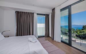 Posteľ alebo postele v izbe v ubytovaní 270 Panorama Kvarner