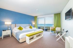 Cama ou camas em um quarto em Aqua Natura Madeira