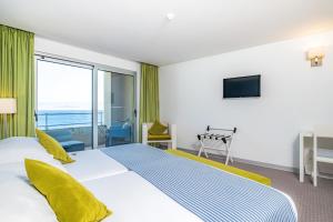 Cama ou camas em um quarto em Aqua Natura Madeira