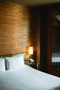 Posteľ alebo postele v izbe v ubytovaní Fonda Hotel 1771