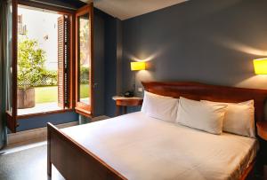 Posteľ alebo postele v izbe v ubytovaní Fonda Hotel 1771