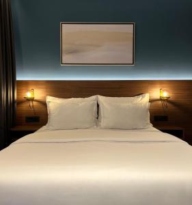 Postel nebo postele na pokoji v ubytování Boutique ROOMs 76