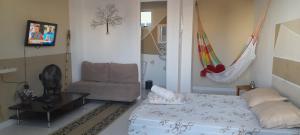 Μια τηλεόραση ή/και κέντρο ψυχαγωγίας στο Loft 2 Quadras da Praia do Recreio