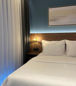 Postel nebo postele na pokoji v ubytování Boutique ROOMs 76