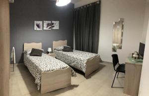 Ένα ή περισσότερα κρεβάτια σε δωμάτιο στο B&B La Casa di Violetta
