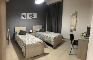 Postel nebo postele na pokoji v ubytování B&B La Casa di Violetta