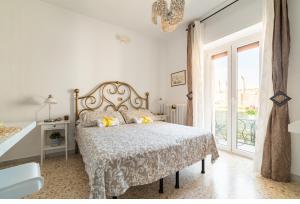 Postel nebo postele na pokoji v ubytování Dany's House grazioso monolocale indip