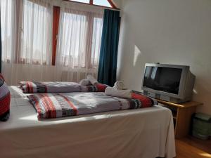 Postel nebo postele na pokoji v ubytování Parton Hotel & Bowling
