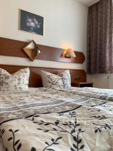 Postel nebo postele na pokoji v ubytování Hotel Plovdiv