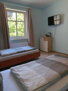 Postel nebo postele na pokoji v ubytování Hotel Plovdiv