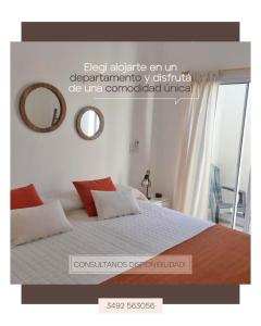 Cartel de un dormitorio con cama y espejo en Mono ambiente amplio, luminoso y moderno con excelente ubicación en Rafaela