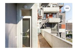 an open door on a balcony of a building at 1BR Cozy apartment in Batumi