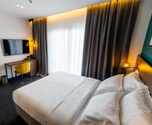 Postel nebo postele na pokoji v ubytování Boutique ROOMs 76