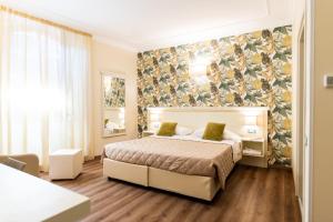 Postel nebo postele na pokoji v ubytování Hotel Corso
