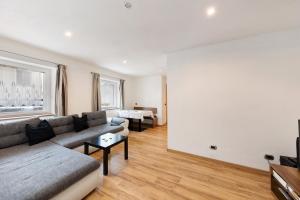 a living room with a couch and a table at Apartment Bergkristall in Nova Levante