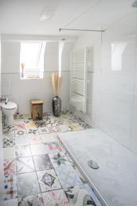 a bathroom with a shower and a toilet and a sink at Anni`s Inn in Bruchsal