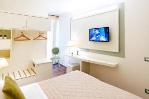 Postel nebo postele na pokoji v ubytování Hotel Corso