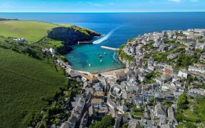 an aerial view of a coastal town with the ocean at Brakestone Cottage in the heart of Port Isaac in Port Isaac