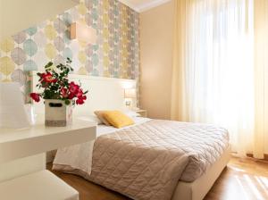 Postel nebo postele na pokoji v ubytování Hotel Corso