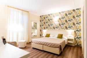 Postel nebo postele na pokoji v ubytování Hotel Corso