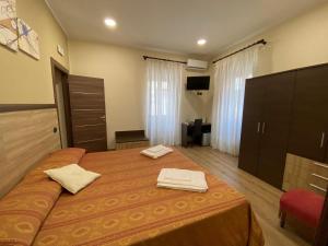 Postel nebo postele na pokoji v ubytování B&B Duomo Apartament