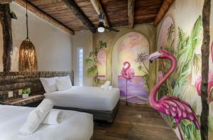 Postel nebo postele na pokoji v ubytování Hidden Treehouse Tulum Eco-Hotel