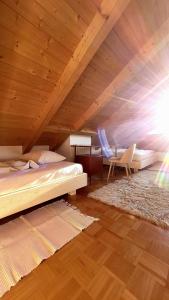 a bedroom with a bed and a wooden ceiling at Apartment Stella in San Lorenzo di Sebato