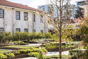 a garden in front of a building at Peppers Gallery Hotel in Canberra