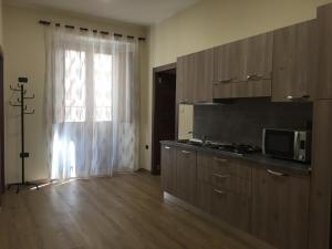 Kuchyň nebo kuchyňský kout v ubytování B&B Duomo Apartament
