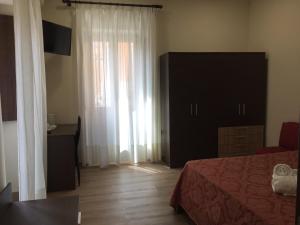 TV a/nebo společenská místnost v ubytování B&B Duomo Apartament