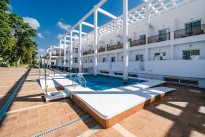 an image of a building with a swimming pool at Hotel Don Ignacio in San José