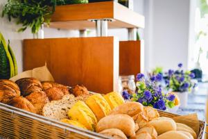 a display of different types of breads and pastries at Hotel Don Ignacio in San José