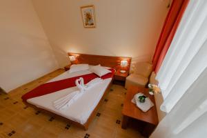 Postel nebo postele na pokoji v ubytování Hotel Callatis