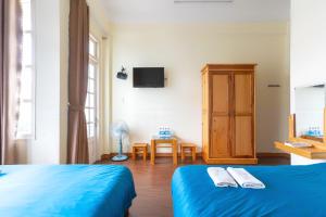 Postel nebo postele na pokoji v ubytování Gia Pham Hotel