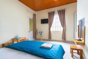 Postel nebo postele na pokoji v ubytování Gia Pham Hotel