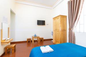 Postel nebo postele na pokoji v ubytování Gia Pham Hotel