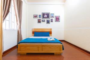 Postel nebo postele na pokoji v ubytování Gia Pham Hotel