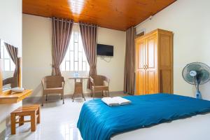 Postel nebo postele na pokoji v ubytování Gia Pham Hotel