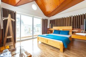 Postel nebo postele na pokoji v ubytování Gia Pham Hotel