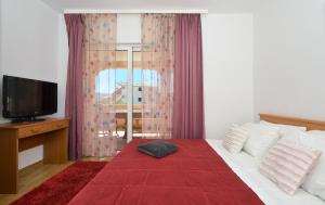 Postel nebo postele na pokoji v ubytování Apartments Luciano