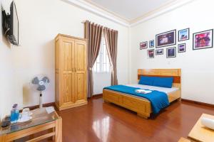Postel nebo postele na pokoji v ubytování Gia Pham Hotel
