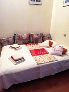 a bed with blankets and pillows on top of it at Apartment Branko in Drage