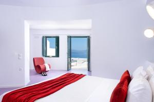 Postel nebo postele na pokoji v ubytování Avant Garde Suites + 37 fotografií