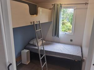 Postel nebo postele na pokoji v ubytování Camping Kersioual